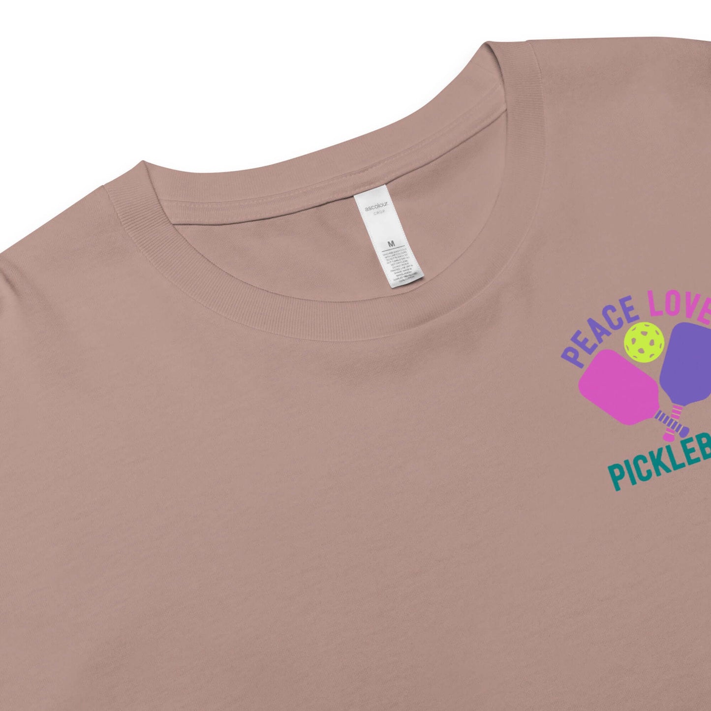 Women's Peace Love Pickleball Crop Top in beige with colorful graphic design.