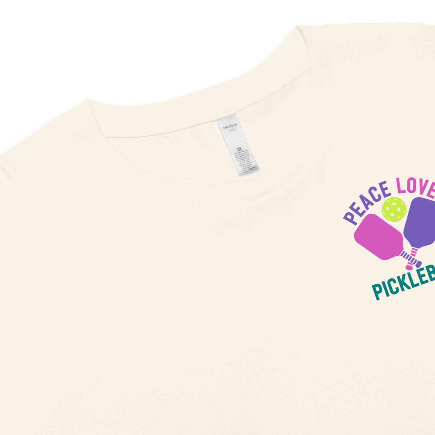 Women’s Peace, Love, Pickleball crop top featuring a colorful graphic on a light background.