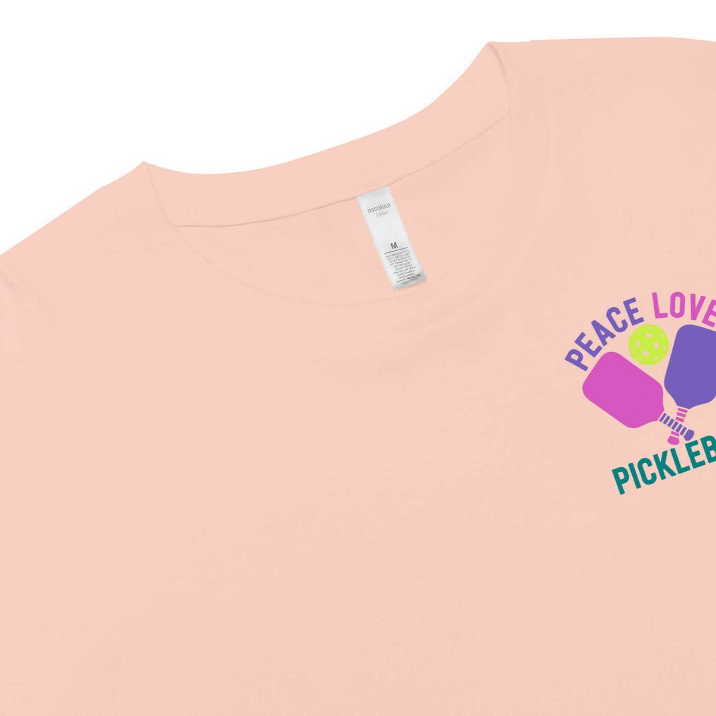 Close-up of Women's Peace, Love, Pickleball Crop Top with playful graphic, perfect for stylish pickleball lovers.