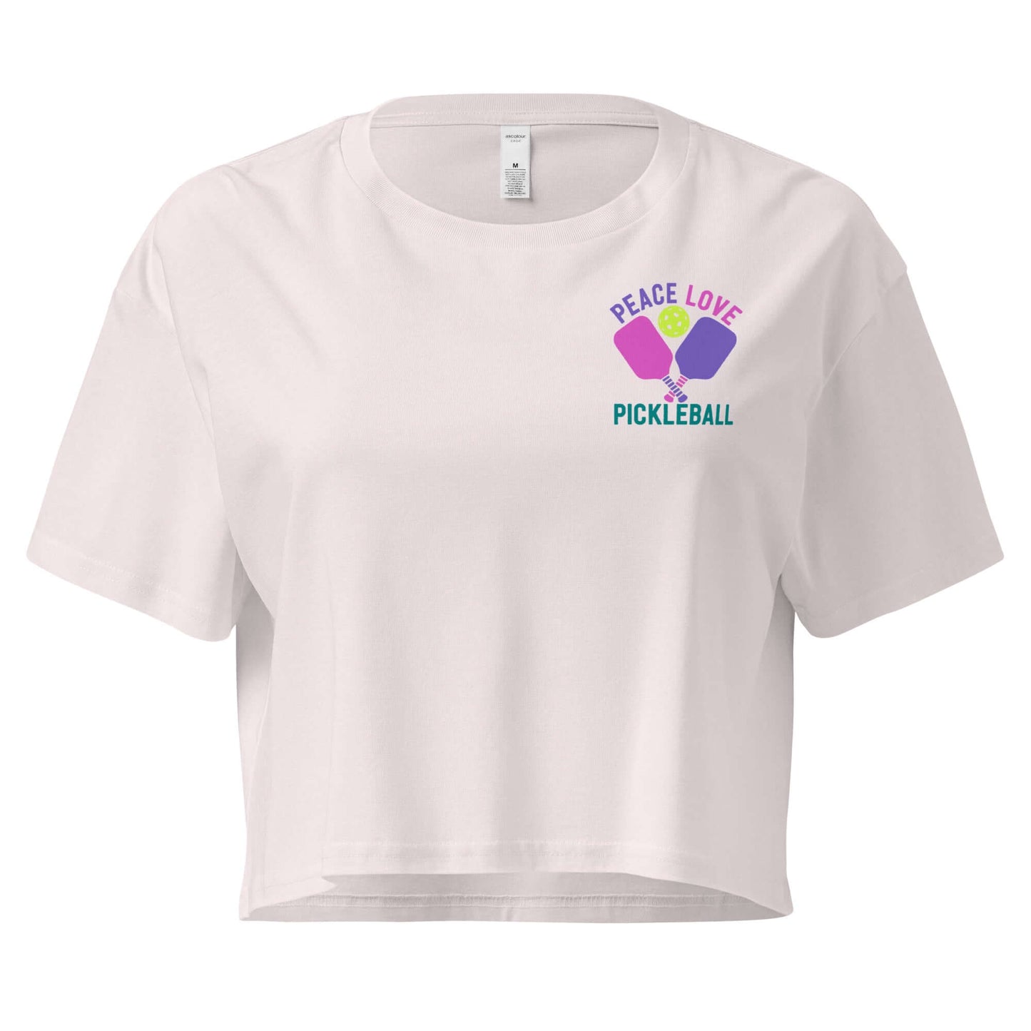 Women's white crop top featuring 'Peace Love Pickleball' graphic design for stylish athletes.