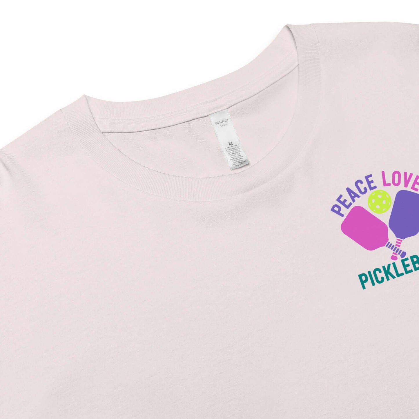 Women's Peace, Love, Pickleball Crop Top featuring colorful graphics on light fabric.