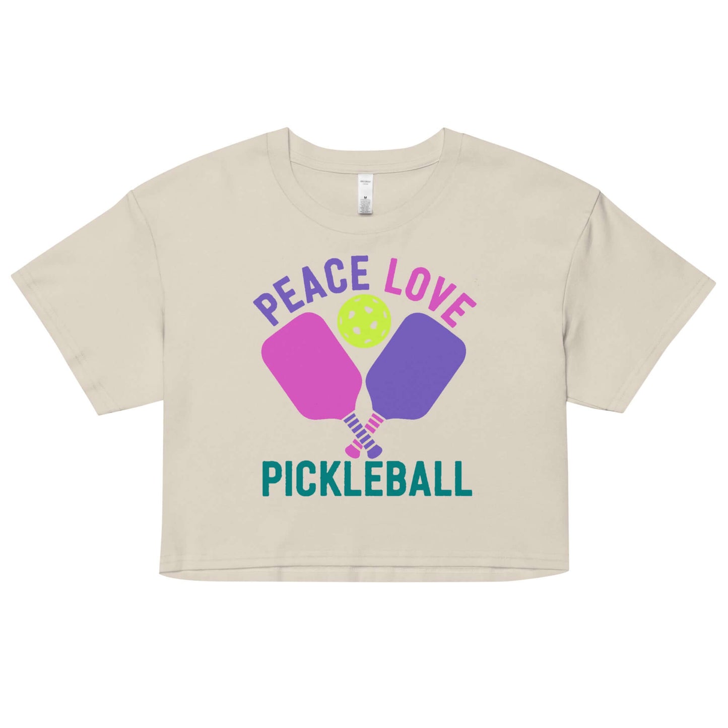 Women's cream crop top featuring 'Peace Love Pickleball' design with colorful paddles and ball.