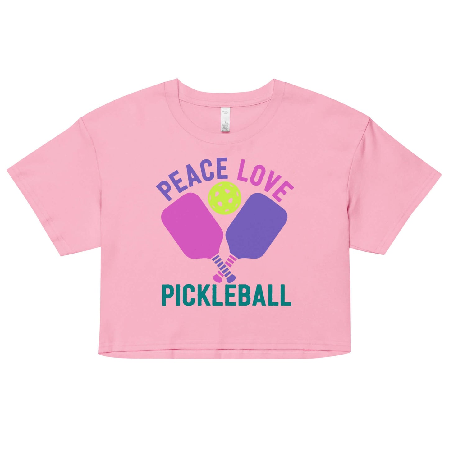 Women's pink crop top featuring 'Peace, Love, Pickleball' design with paddles and ball, perfect for pickleball enthusiasts.