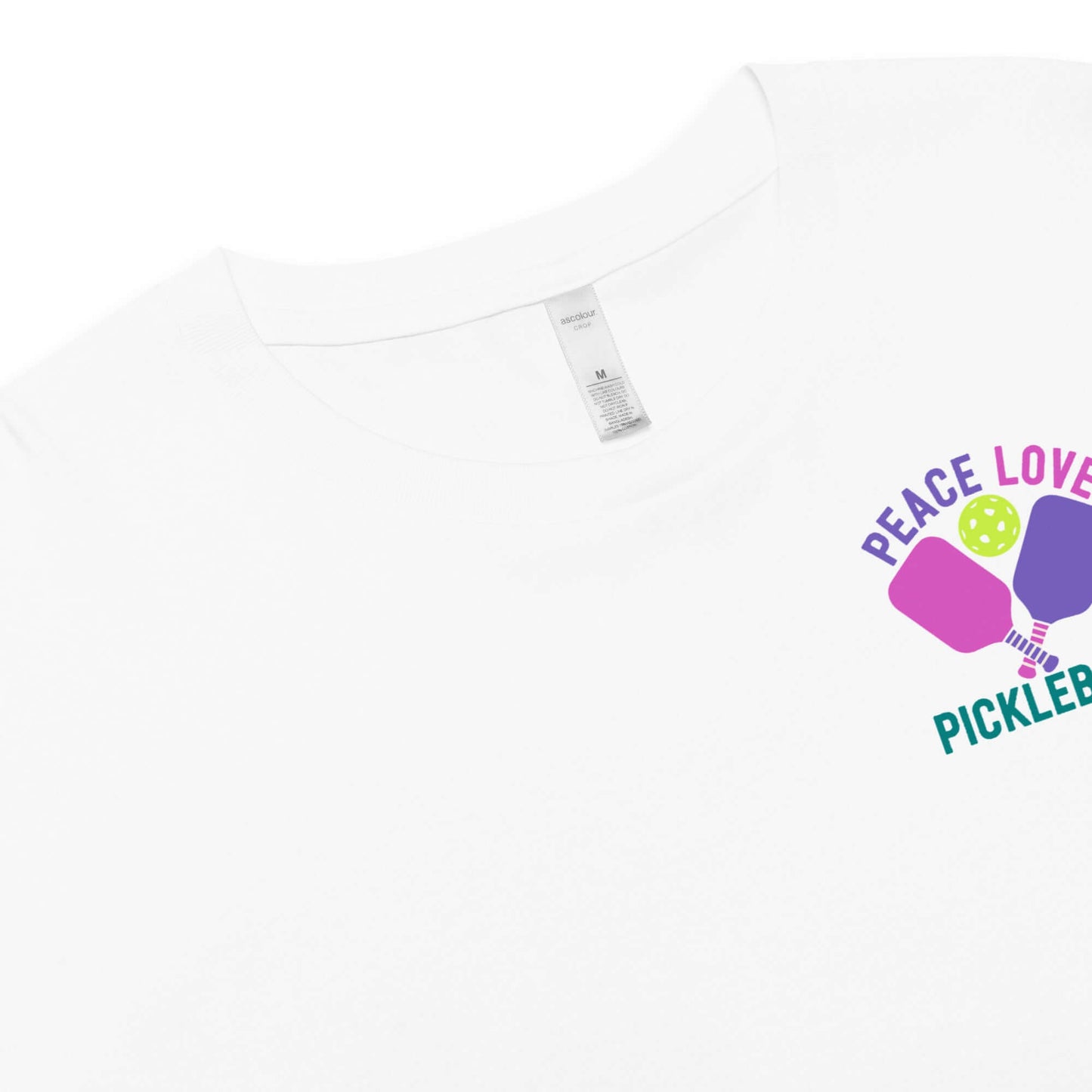 Women's Peace, Love, Pickleball Crop Top featuring colorful graphics on a white shirt.