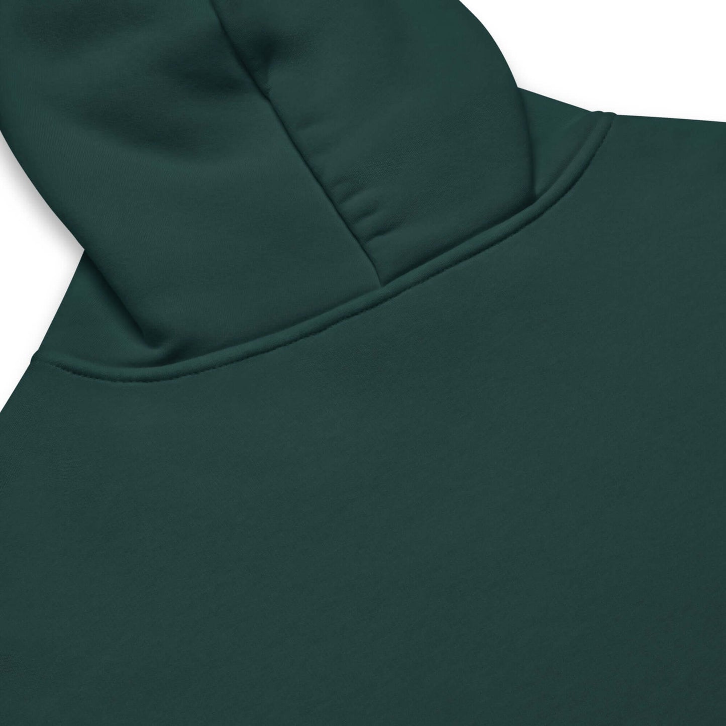 Close-up view of a dark green oversized hoodie, showcasing the hood and relaxed fabric design.