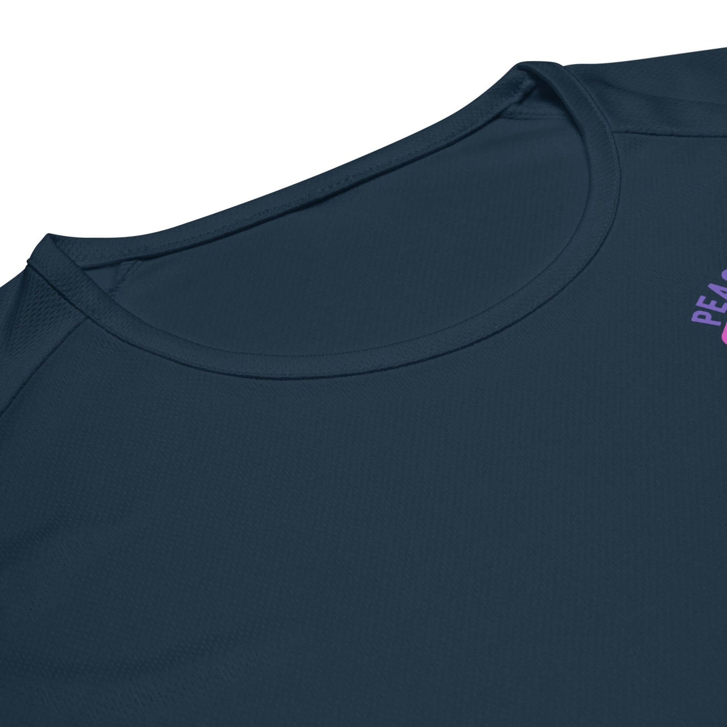 Close-up of Women's Peace, Love, Pickleball Performance Shirt showcasing neckline and logo on a navy background.