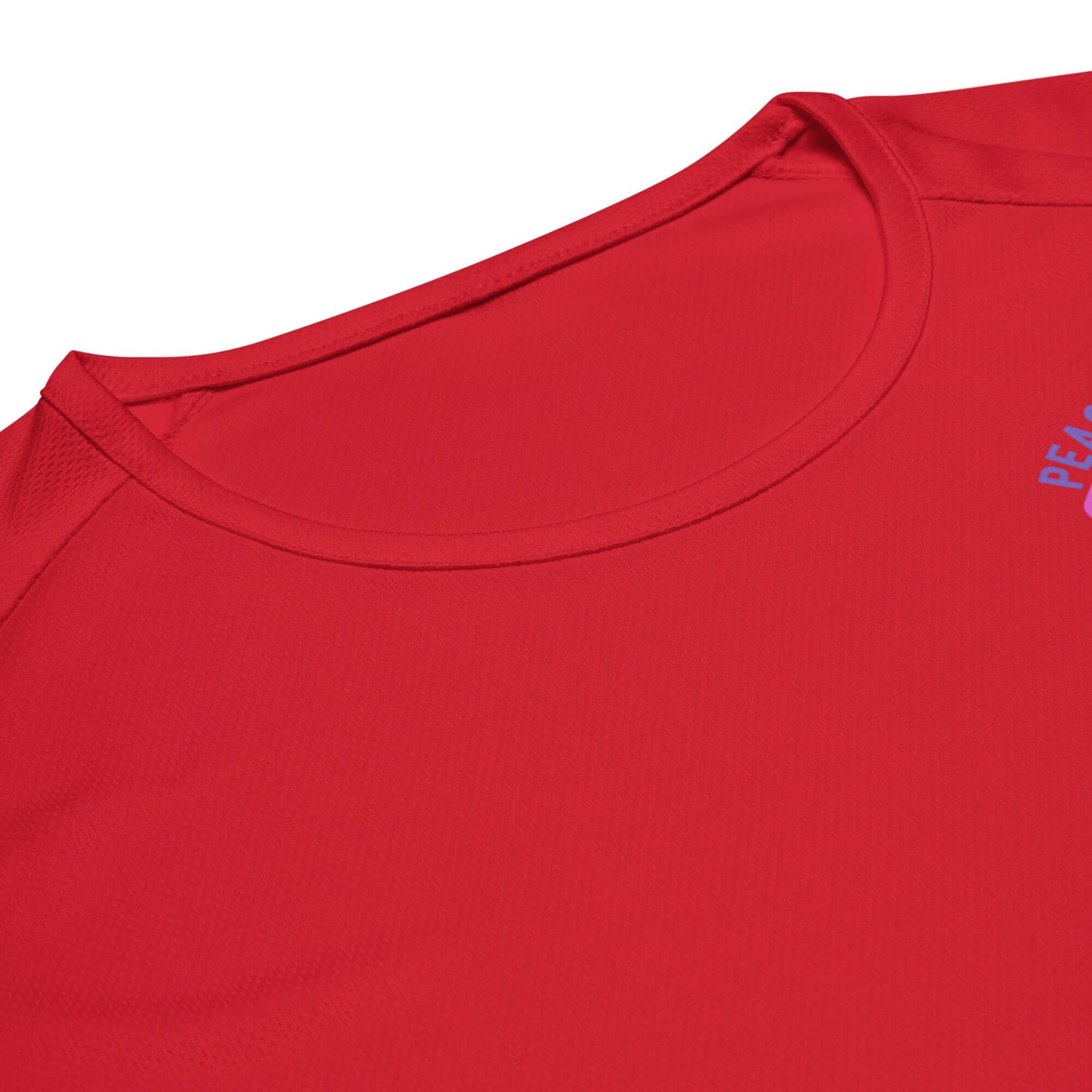 Close-up of a red Women's Peace, Love, Pickleball Performance Shirt, highlighting its stylish neckline.