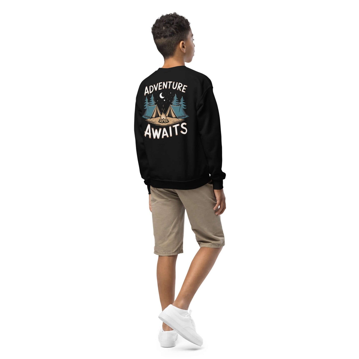 Child wearing Youth Crewneck Sweatshirt with 'Adventure Awaits' graphic on back, perfect for outdoor adventures.