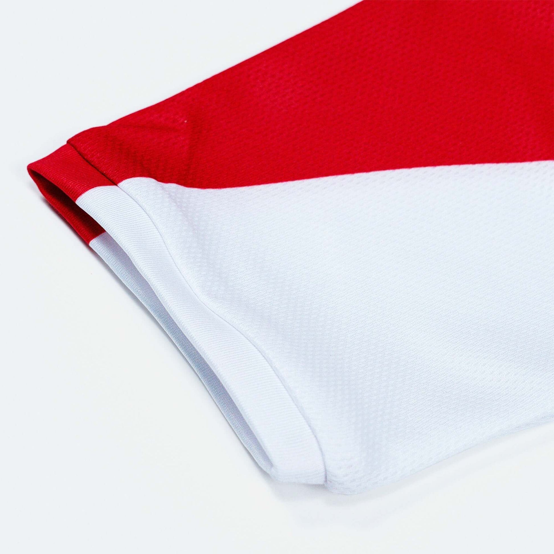 Crossbones Merica Jersey close-up, featuring vented red and white polyester mesh fabric for optimal breathability and comfort.