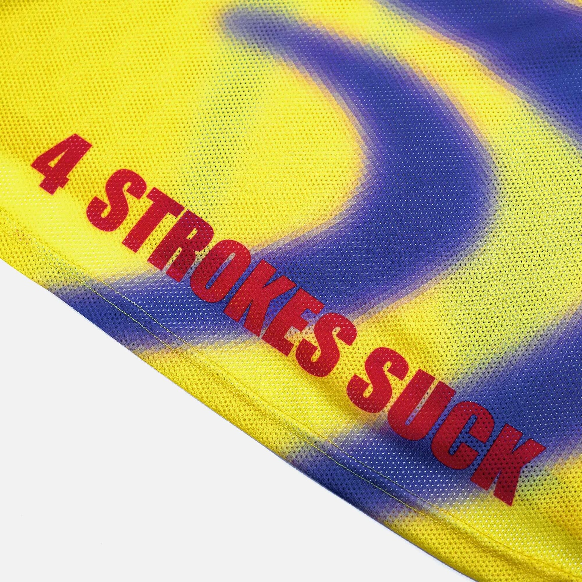 Close-up of Crossbones Helmet 69 Jersey with "4 Strokes Suck" text in bold red letters on yellow and blue mesh fabric.