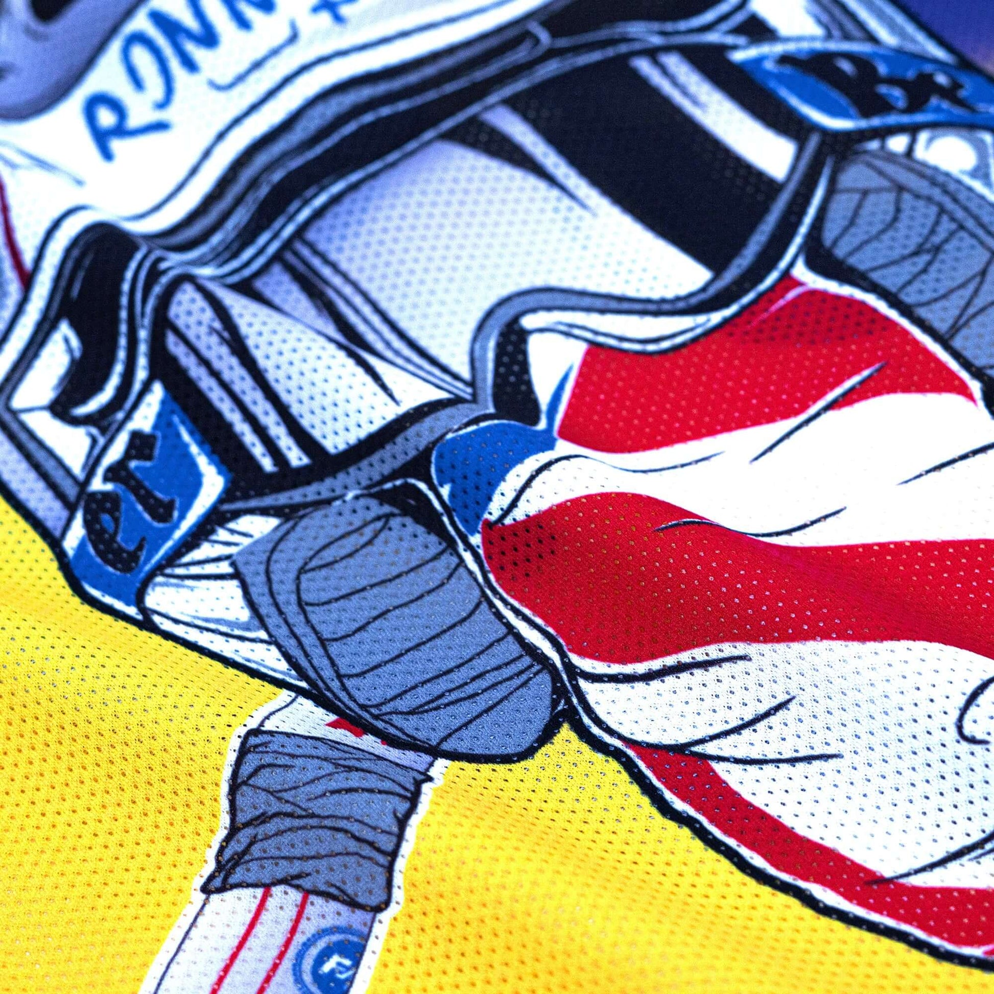 Close-up of Crossbones Helmet 69 Jersey with colorful graphics, featuring vented polyester mesh for optimal comfort and style.