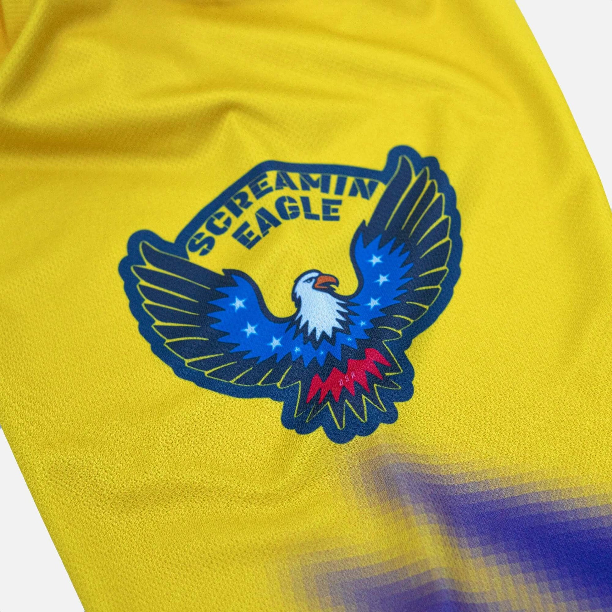Yellow jersey with Screamin Eagle logo featuring a colorful eagle design.