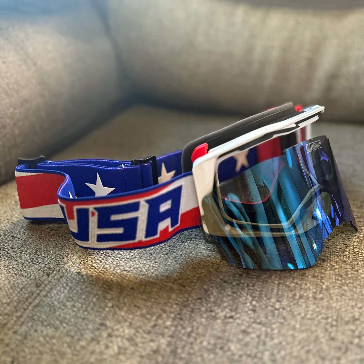 USA Merica Goggles with Oakley Dry Break style lens and patriotic strap design featuring the word "USA" on a textured surface.