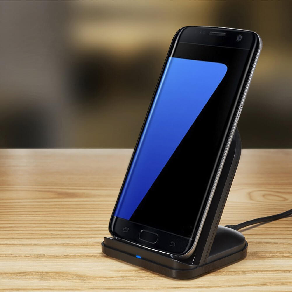 Sleek wireless charging stand with smartphone, ideal for convenient power without cables at home or office.