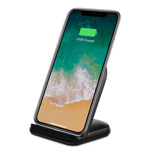 Wireless charging stand for phones with iPhone displaying full charge on screen, providing convenient power solution.