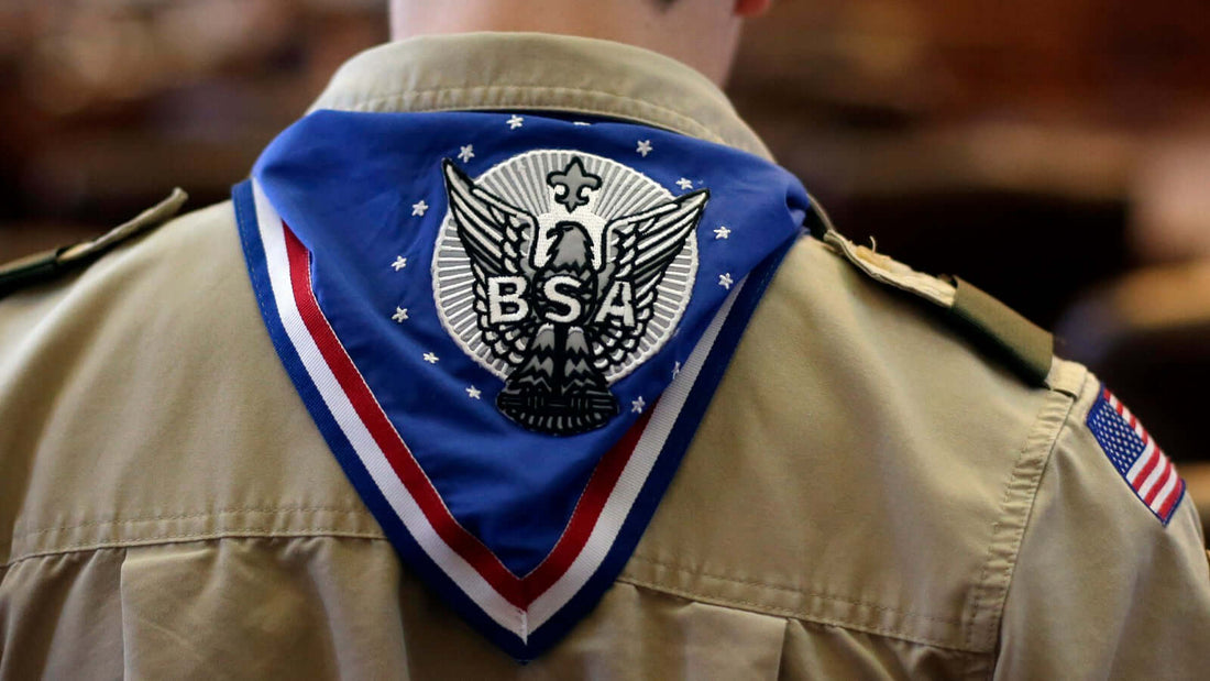 Boy Scout wearing uniform with eagle emblem promoting donation to Eagle Project.