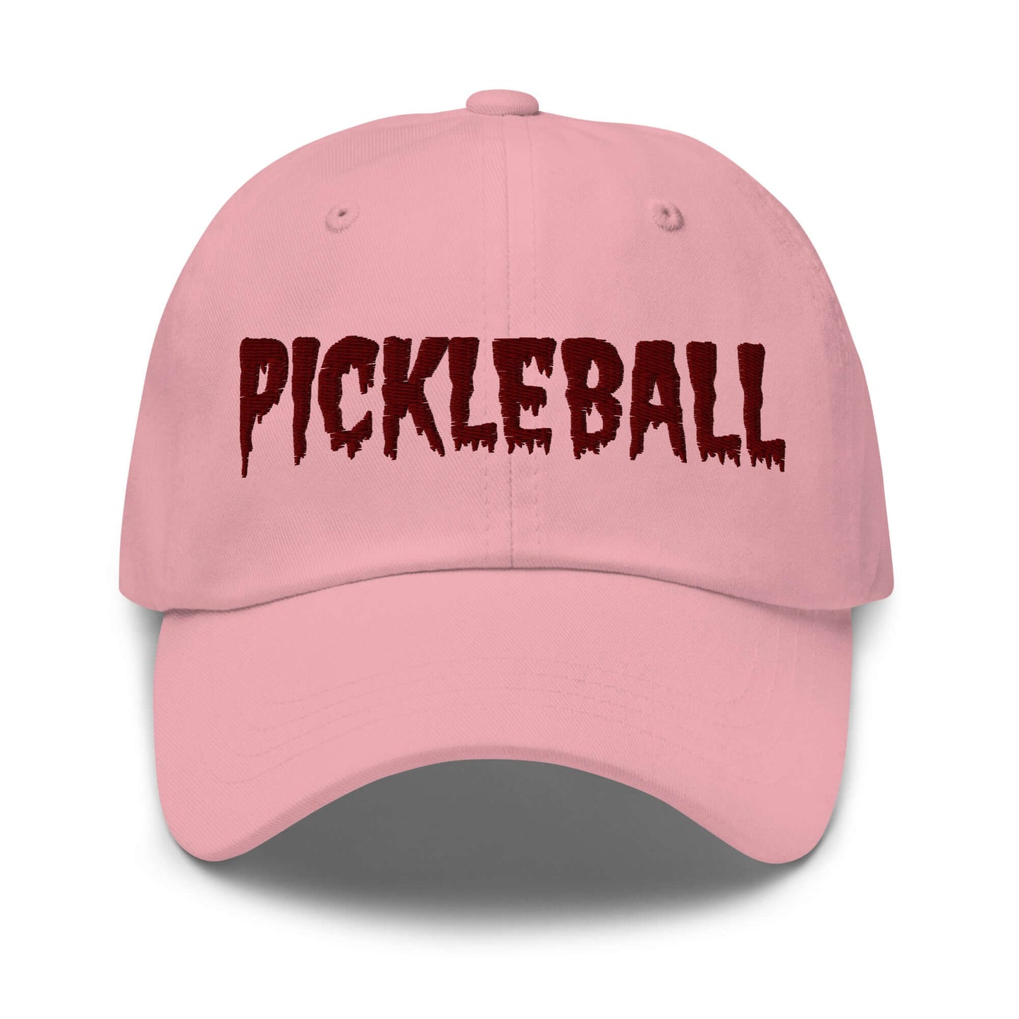 Pink haunted pickleball spirit hat with maroon eerie font embroidery on the front, crafted from 100% chino cotton twill.