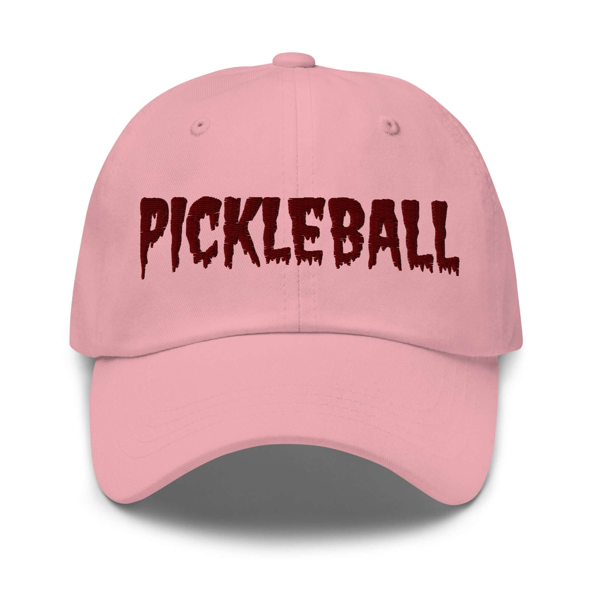 Pink haunted pickleball spirit hat with maroon eerie font embroidery on the front, crafted from 100% chino cotton twill.