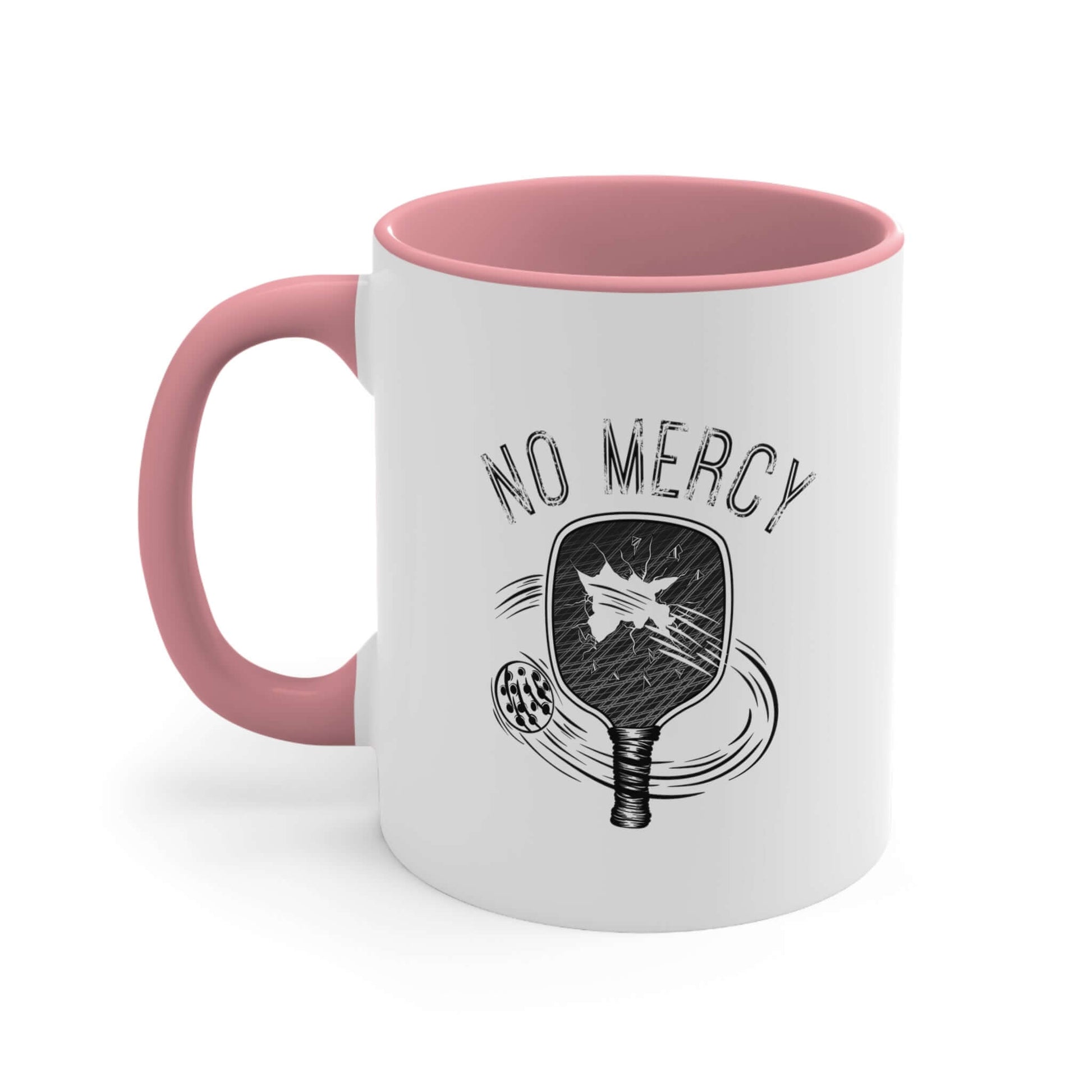 No Mercy Pickleball ceramic coffee mug, 11oz, with a pink handle, featuring a paddle design, ideal for pickleball enthusiasts.