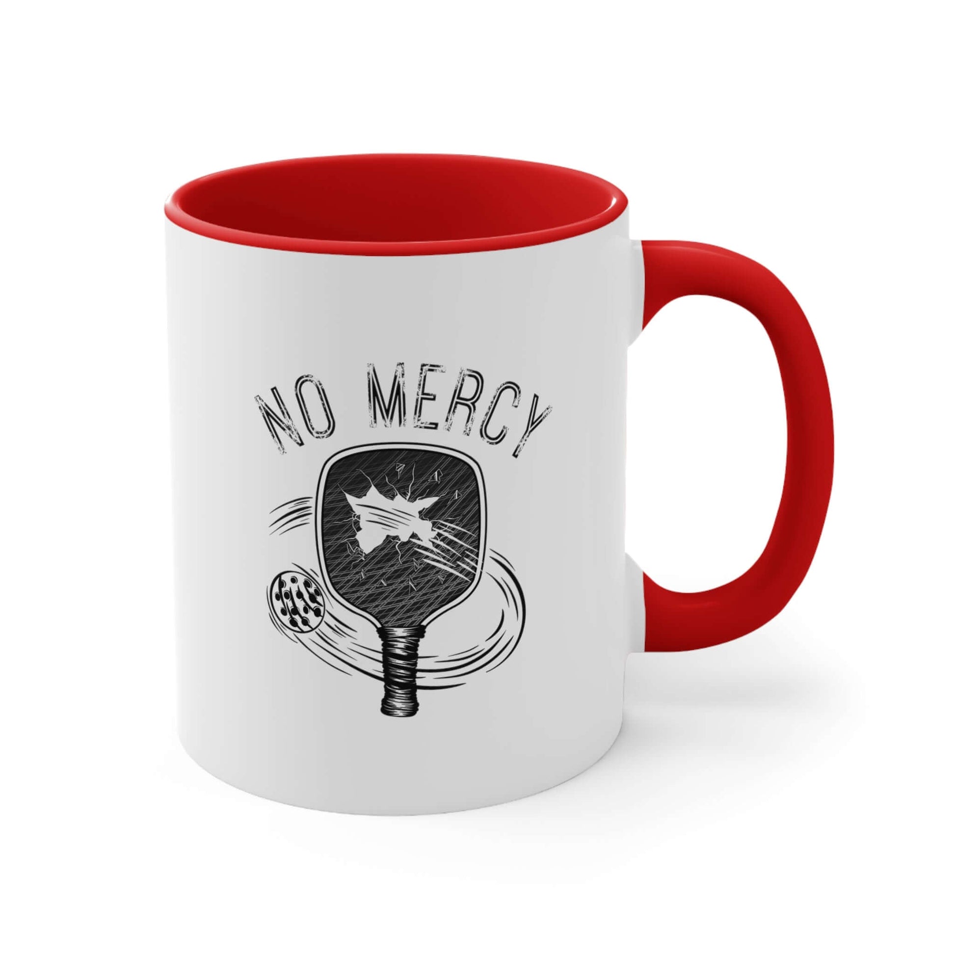 White ceramic 11oz coffee mug with red handle, featuring "No Mercy" pickleball paddle graphic, ideal for pickleball enthusiasts.