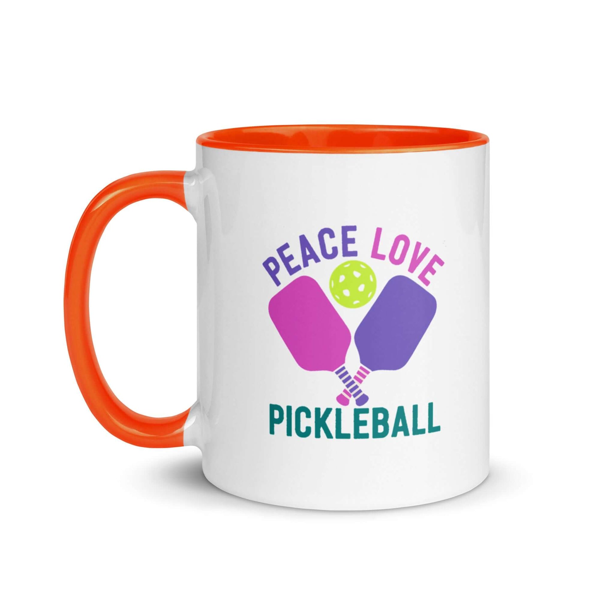 Peace Love Pickleball mug with orange accent, perfect for pickleball enthusiasts sipping coffee or tea.