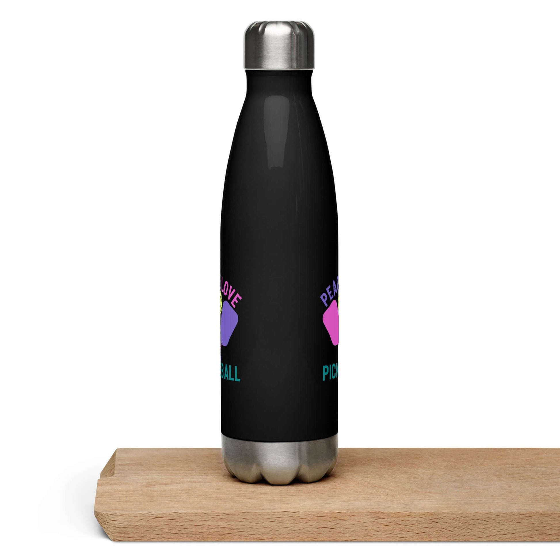 Peace, Love, Pickleball stainless steel water bottle on a wood surface, perfect for hydration and pickleball enthusiasts.