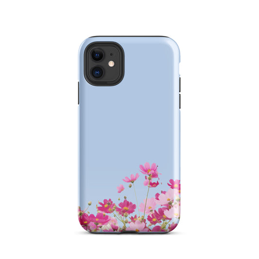 Phone Case for iPhone with blooming floral charm on light blue background, featuring vibrant pink flowers.
