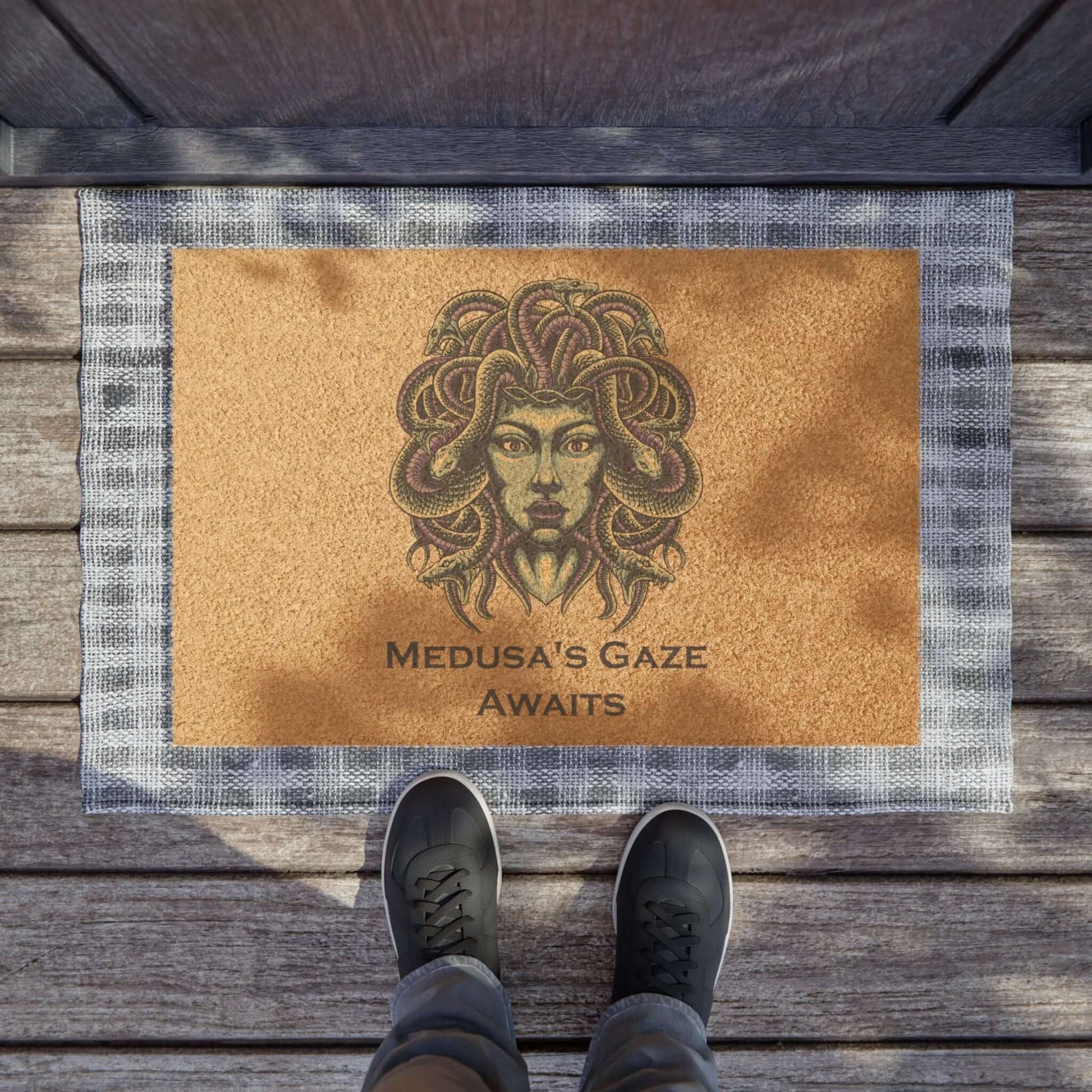 Medusa Halloween doormat with eerie design and text "Medusa's Gaze Awaits" at doorstep, perfect for spooky decor.