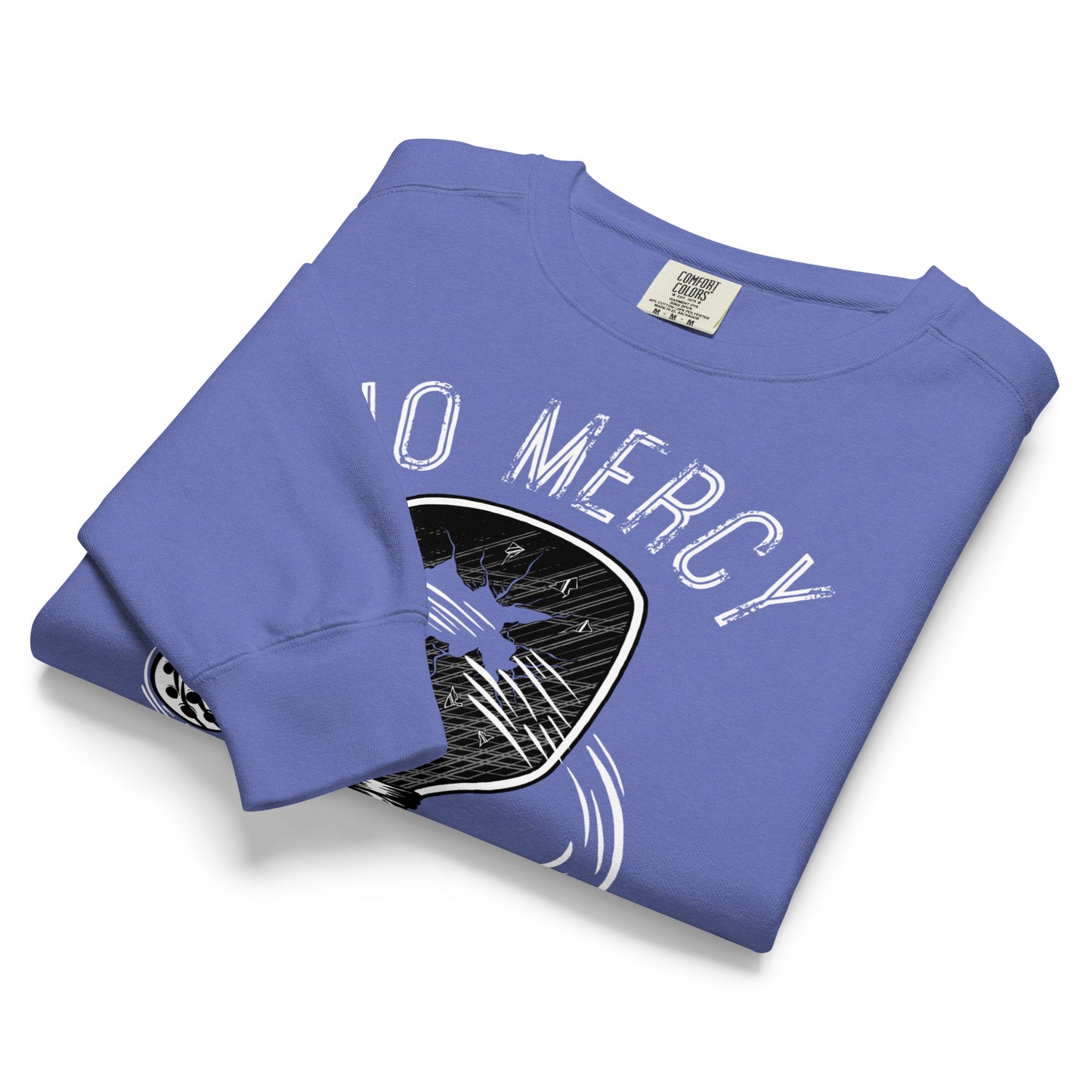 Pickleball No Mercy Series unisex garment-dyed sweatshirt in blue, folded and displaying vintage graphic design.