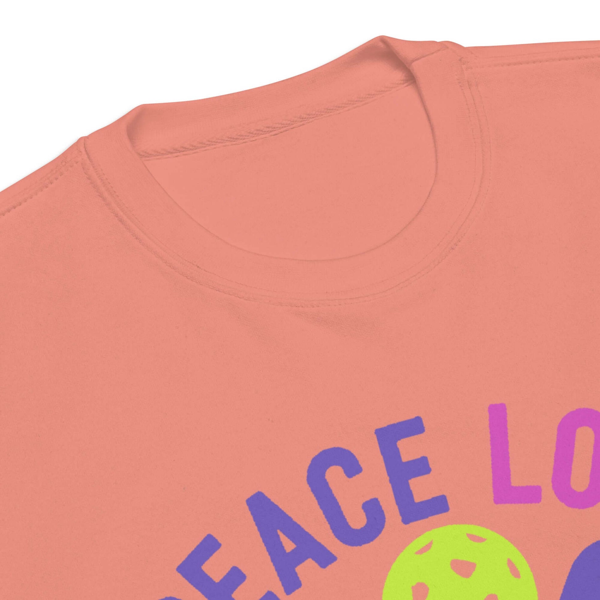 Close-up of the Women's Peace, Love, Pickleball Premium Sweatshirt showing collar and vibrant graphic design.