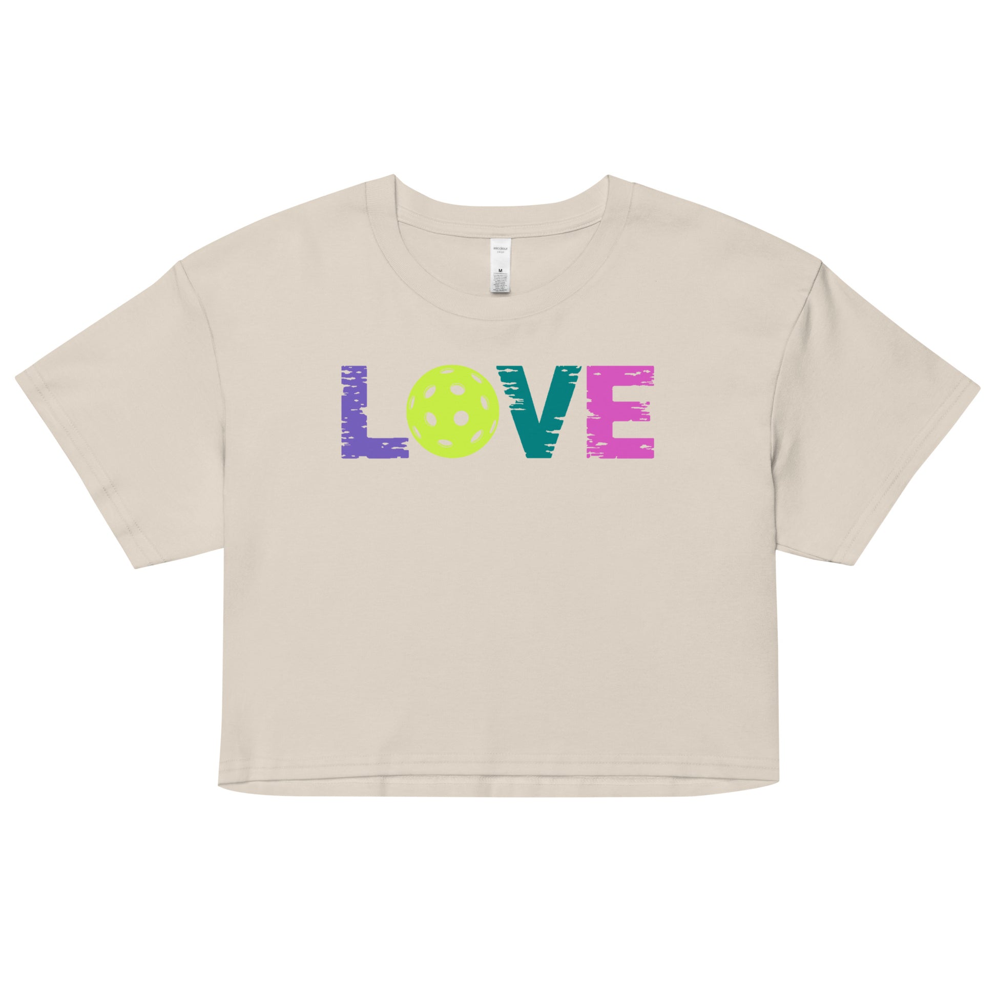 Women’s LOVE Pickleball Crop Top in beige with colorful text and pickleball design.