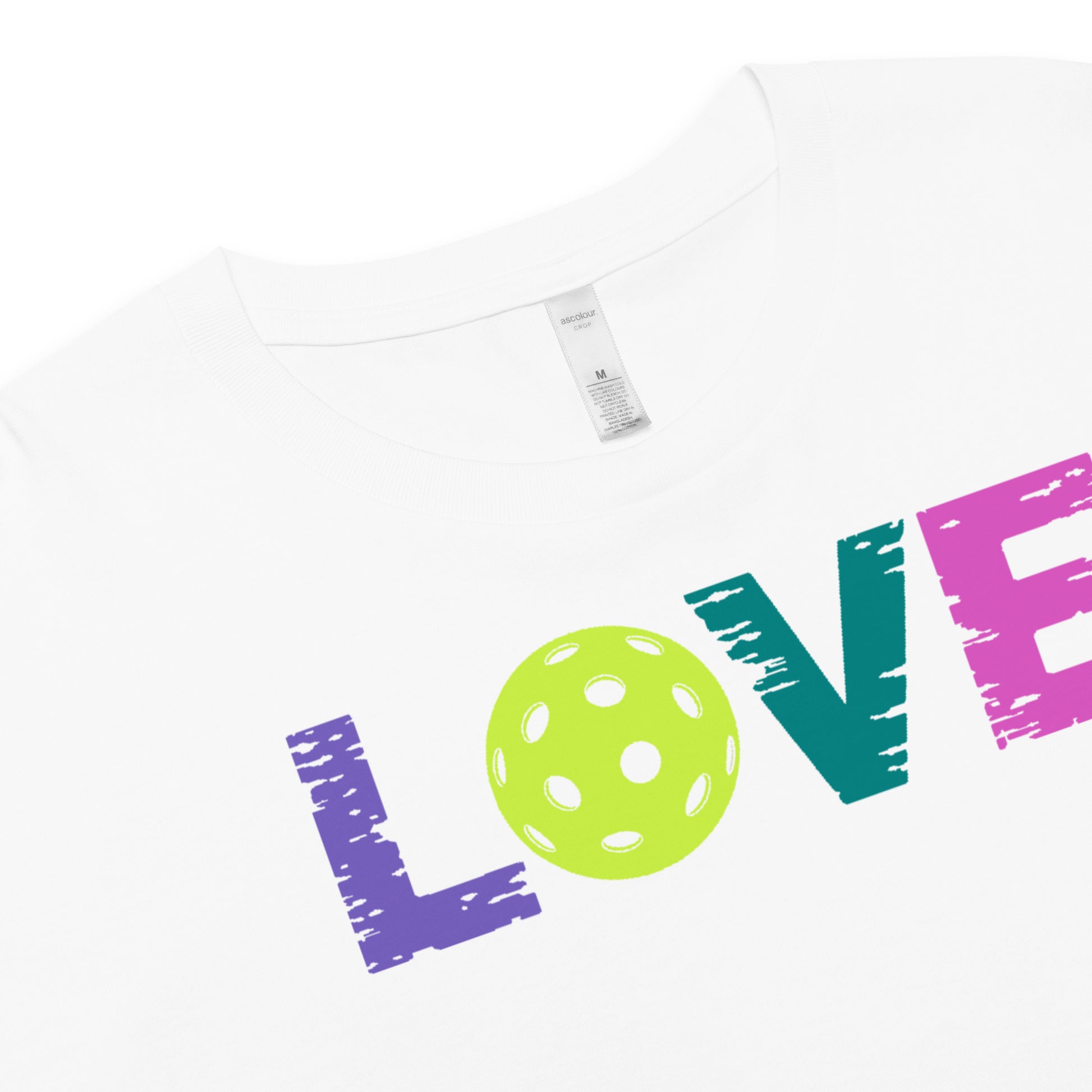 White crop top with colorful "LOVE" text and pickleball graphic, perfect for pickleball enthusiasts.
