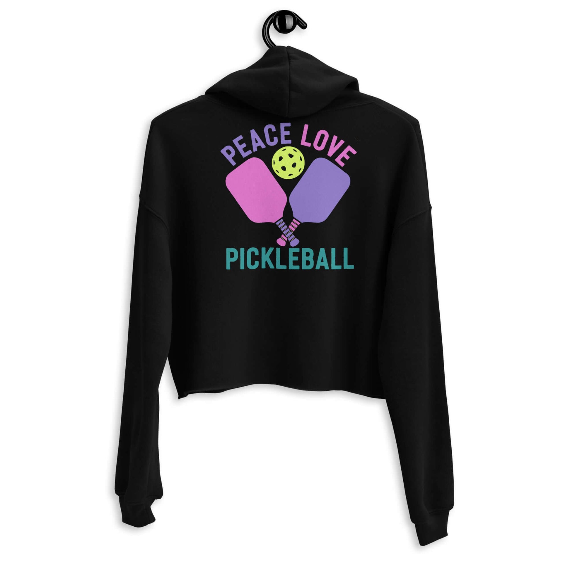 Black women's crop hoodie with 'Peace Love Pickleball' graphic and pickleball paddles design on the back.