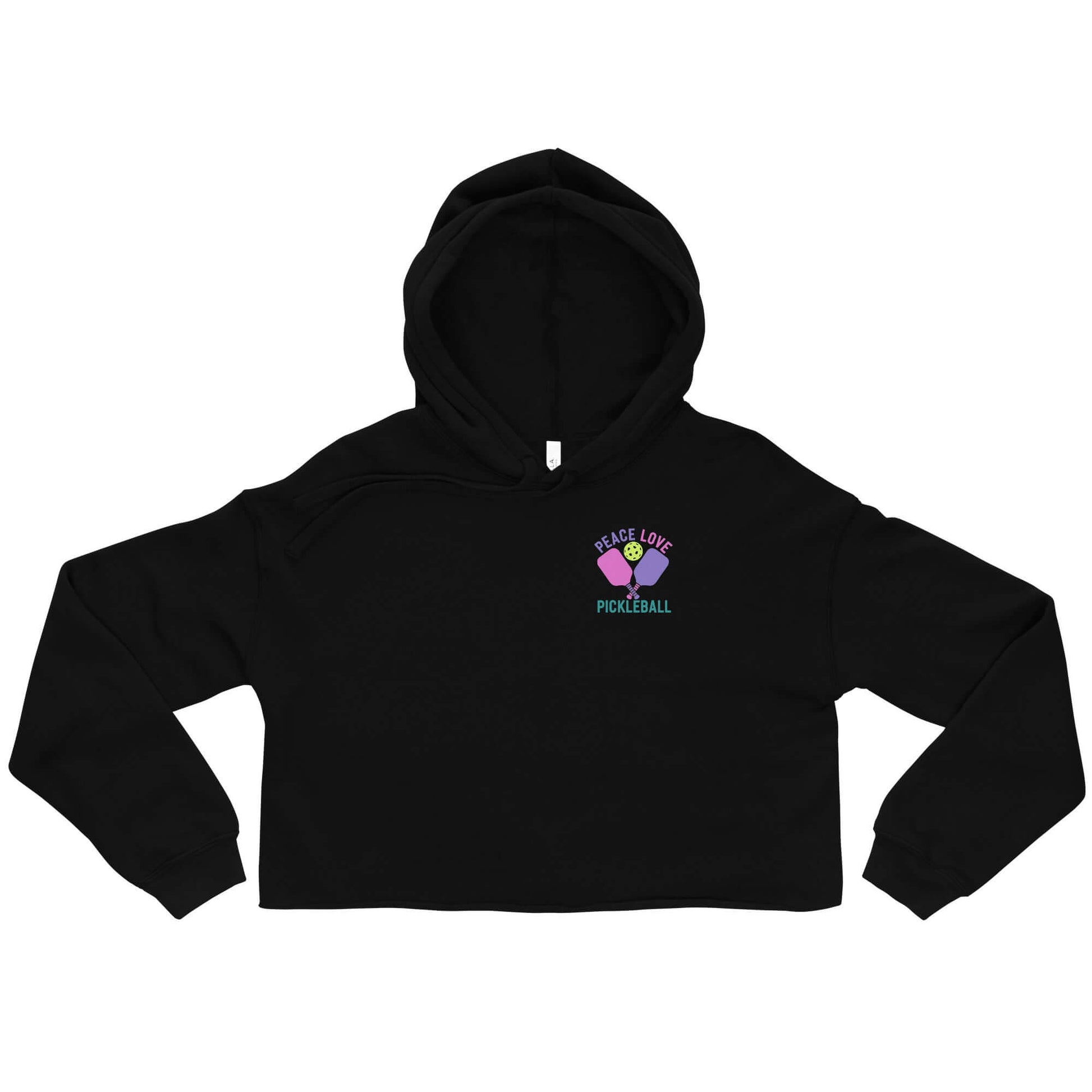 Women's black crop hoodie featuring 'Peace Love Pickleball' graphic, perfect for stylish pickleball players.