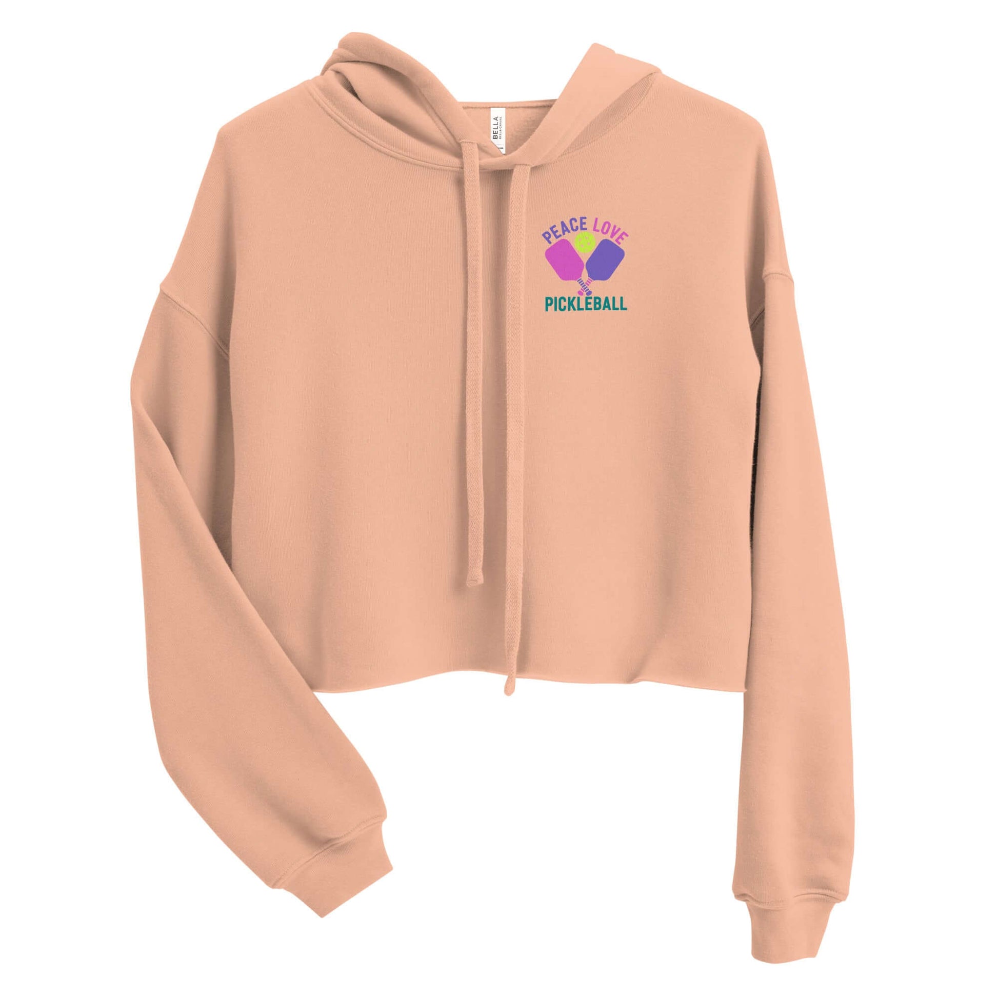 Women's peach crop hoodie with 'Peace Love Pickleball' graphic and drawstrings, perfect for sporty and stylish looks.