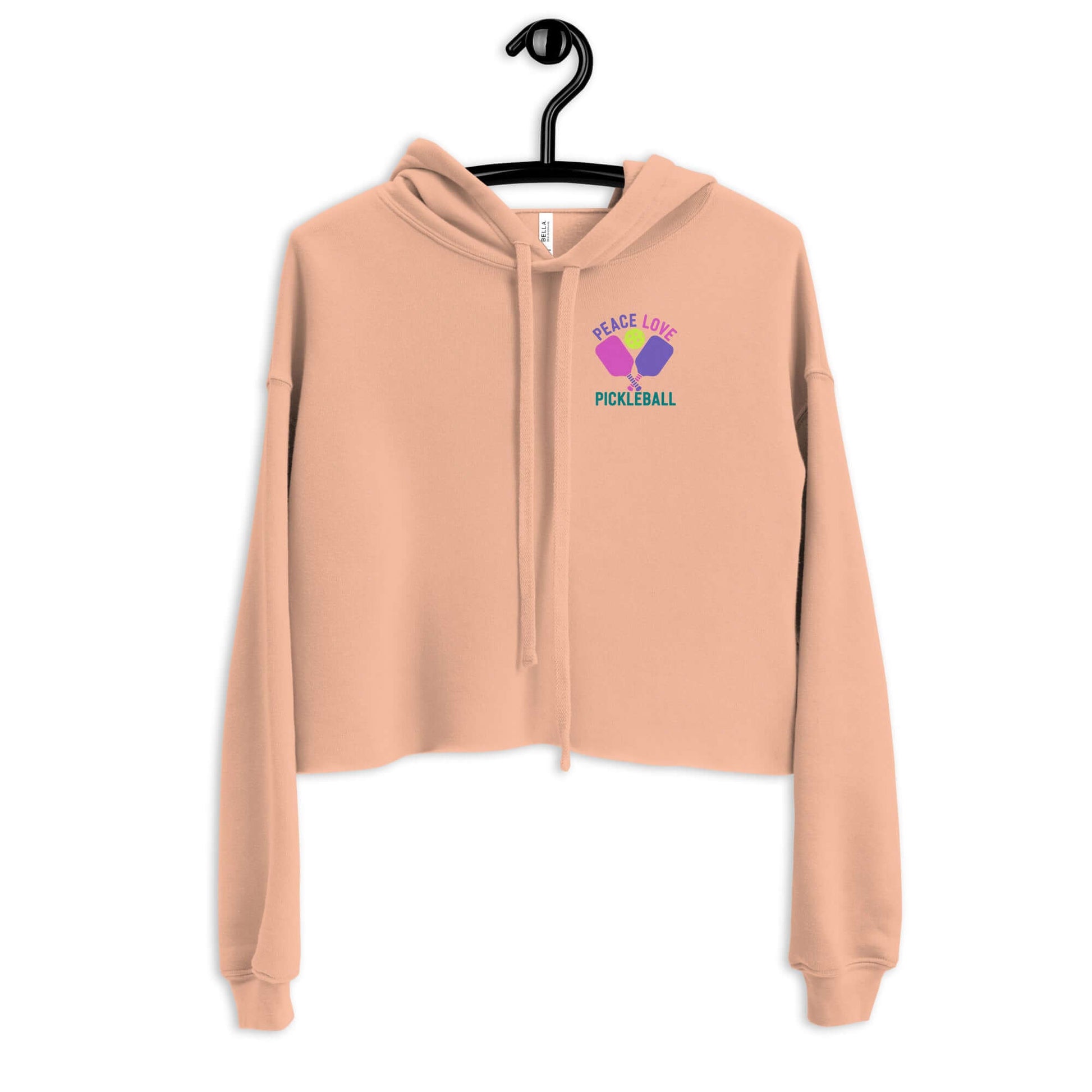 Women's Peace Love Pickleball Crop Hoodie in soft beige with vibrant design, perfect for sporty style and comfort.