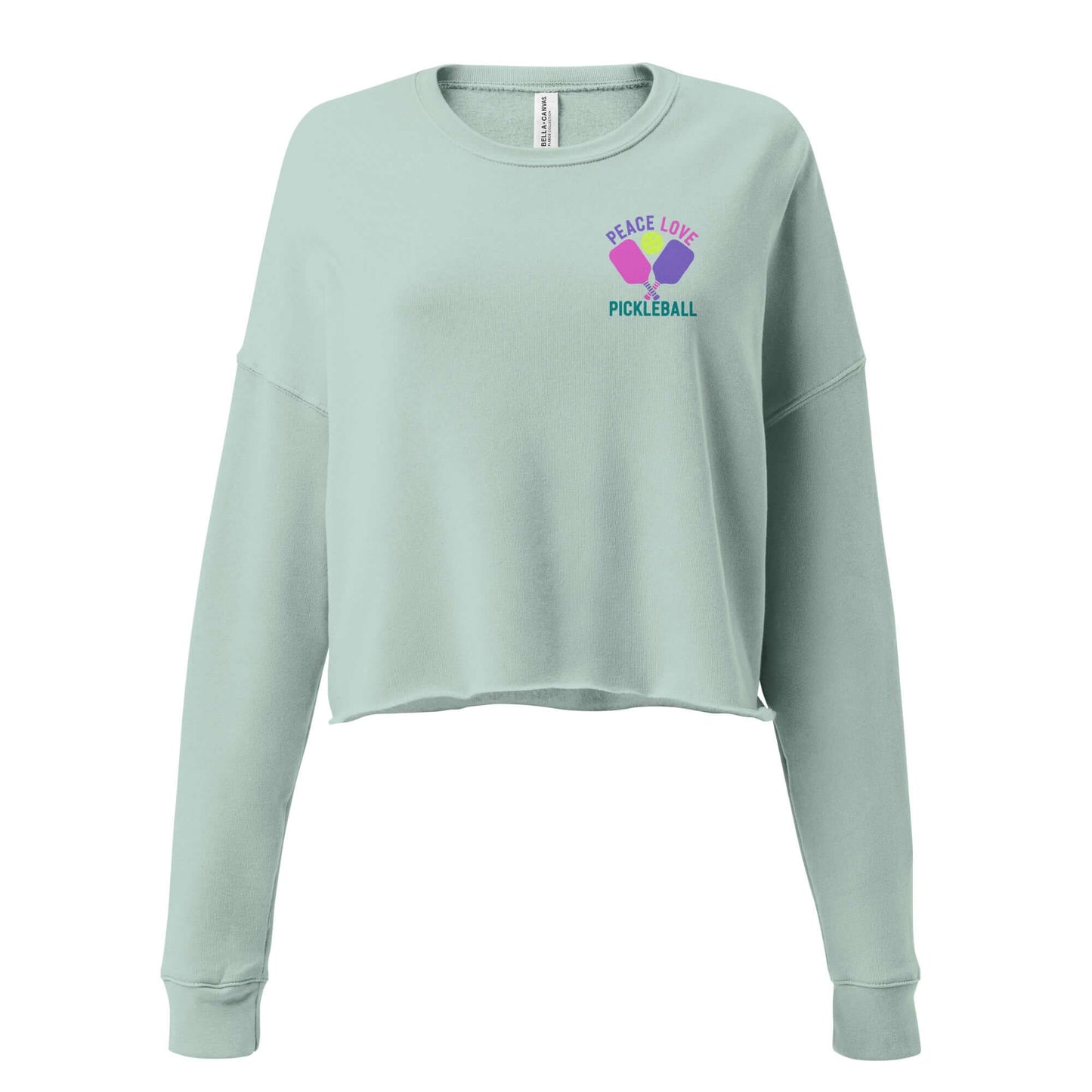 Women's crop sweatshirt with 'Peace Love Pickleball' graphic, perfect for fashion-forward pickleball fans.