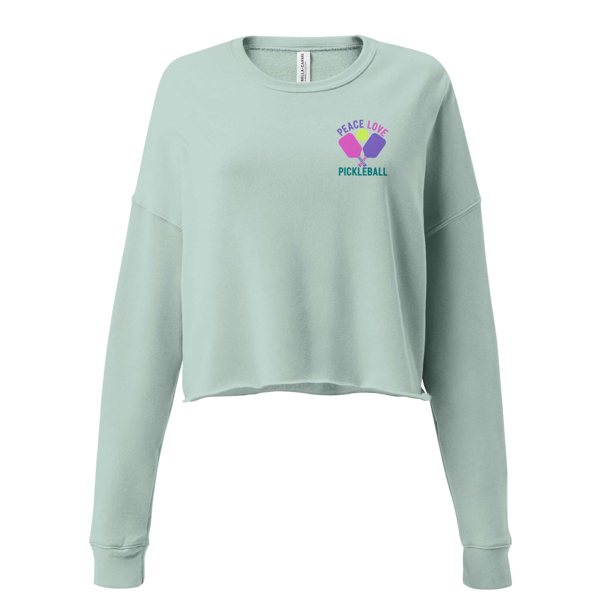Women's crop sweatshirt with 'Peace Love Pickleball' graphic, perfect for fashion-forward pickleball fans.
