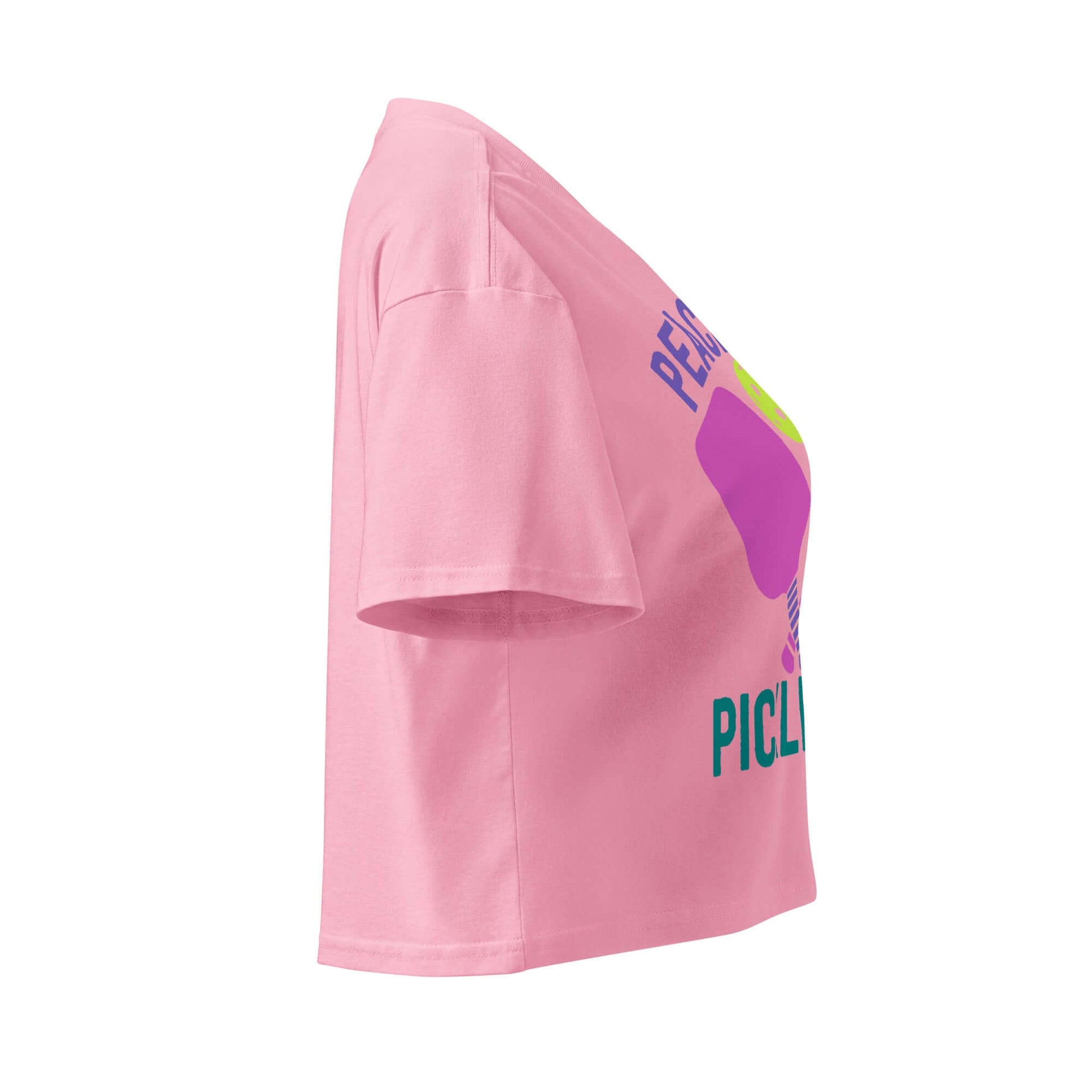 Side view of Women's Peace, Love, Pickleball Crop Top in pink with vibrant design.