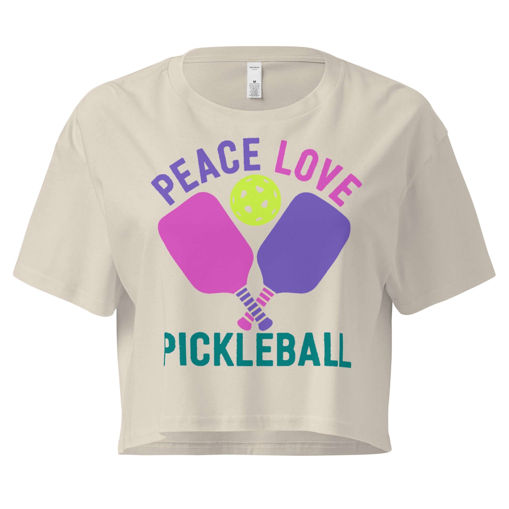 Women's cream crop top featuring 'Peace Love Pickleball' design with paddles and ball.