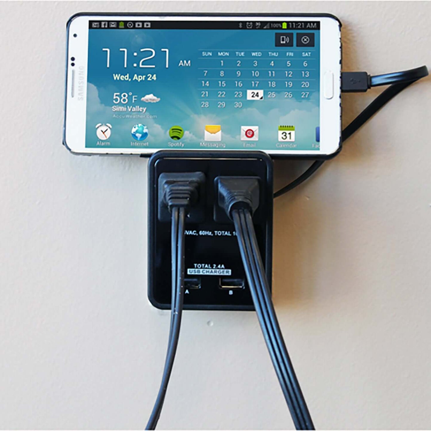 Compact power station charging a smartphone with dual USB ports, compact design, and efficient power output for multiple devices.